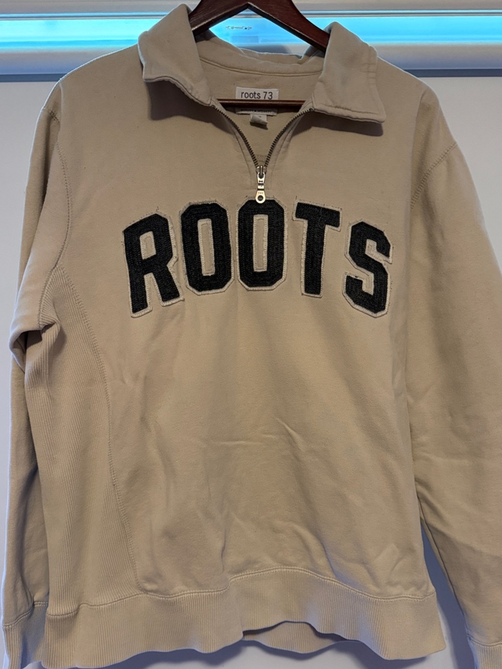 Roots Beige Unisex Quarter Zip Sweatshirt with Black Lettering